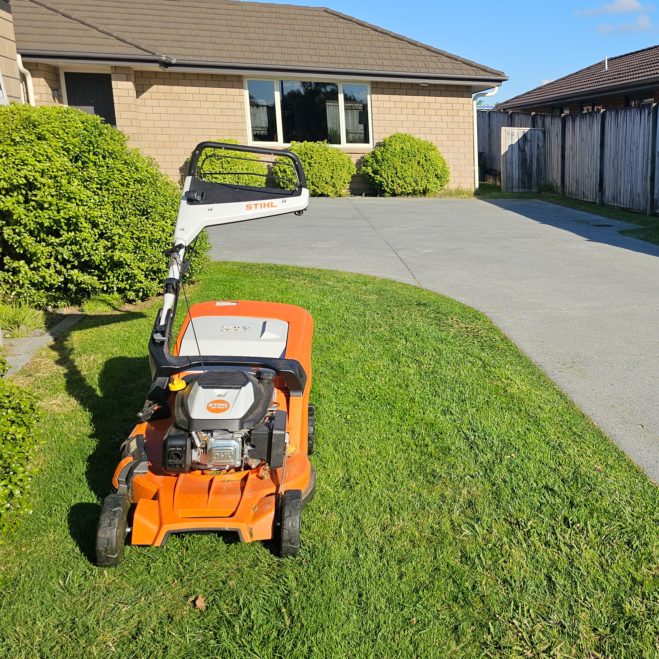 Lawn mower on fresh grass